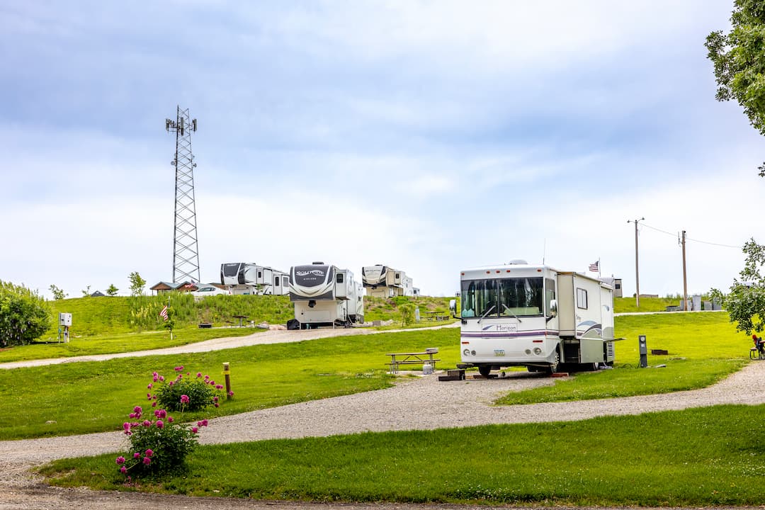 Motorhomes parked on grassy full-hookup RV sites at Alta Campground